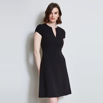 A woman wearing a black short-sleeved shirt