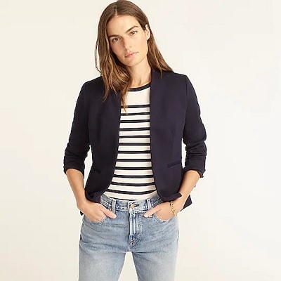 professional woman wears collarless blazer