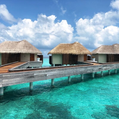 over-water bungalows somewhere tropical