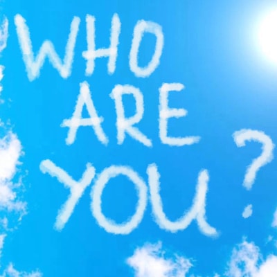 skywritten letters read "Who Are You?"