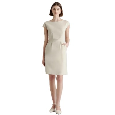 A woman in a beige cap-sleeve dress