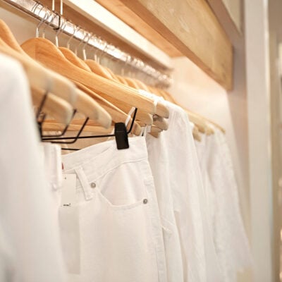 white pants for work, hanging on a rack; graphic says "updated!"