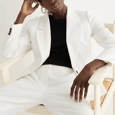A woman wearing a white parke blazer