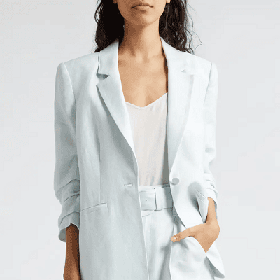 woman wears pale blue summer blazer in cotton-linen blend