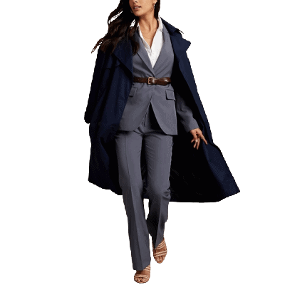 woman in gray suit with brownish belt, wearing a black overcoat over her shoulders
